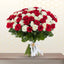 Fresh bunch of pure white and red roses professionally arranged in an elegant floral bouquet.