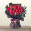 red roses bouquet in black wrapping
