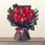 red roses bouquet in black wrapping