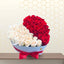 IRISH WISH luxury heart-shaped box featuring a split arrangement of fresh white roses on the left and red roses on the right, finished with a red satin bow.