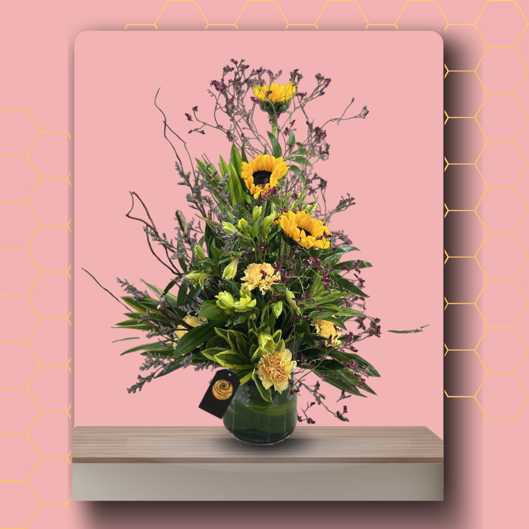 Floral arrangement with yellow flowers in a green vase on a pink background Main image