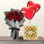 Red rose bouquet in grey wrapping with black ribbon, next to a 24-piece box of Ferrero Rocher and two heart balloons.