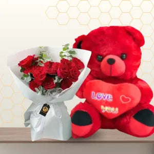 Red rose bouquet in white wrapping sitting next to a giant 90cm red teddy bear. Main image