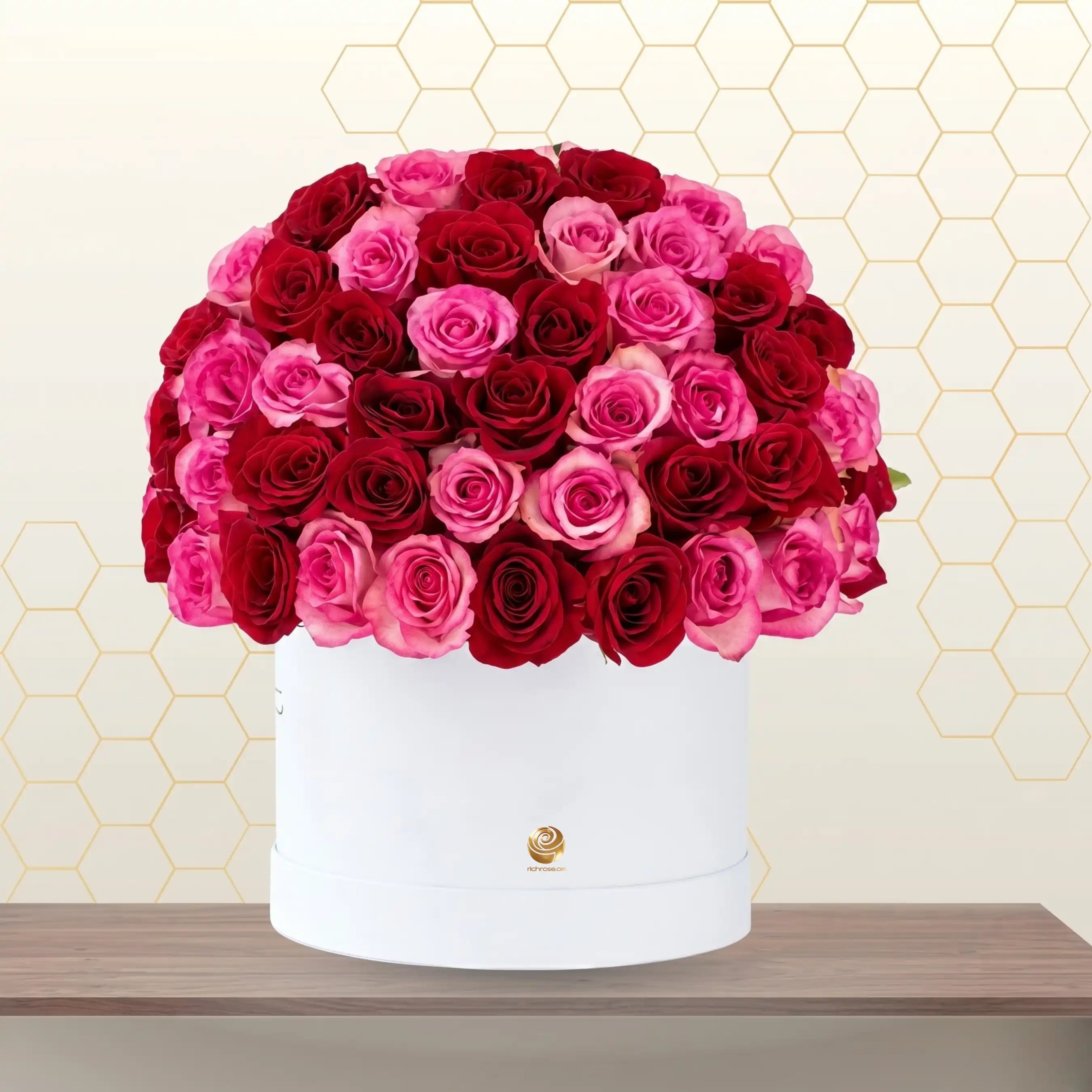 pink and red roses in white flower box Main image
