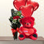 Small bouquet of red roses next to a large 60cm red teddy bear and three red heart-shaped balloons.
