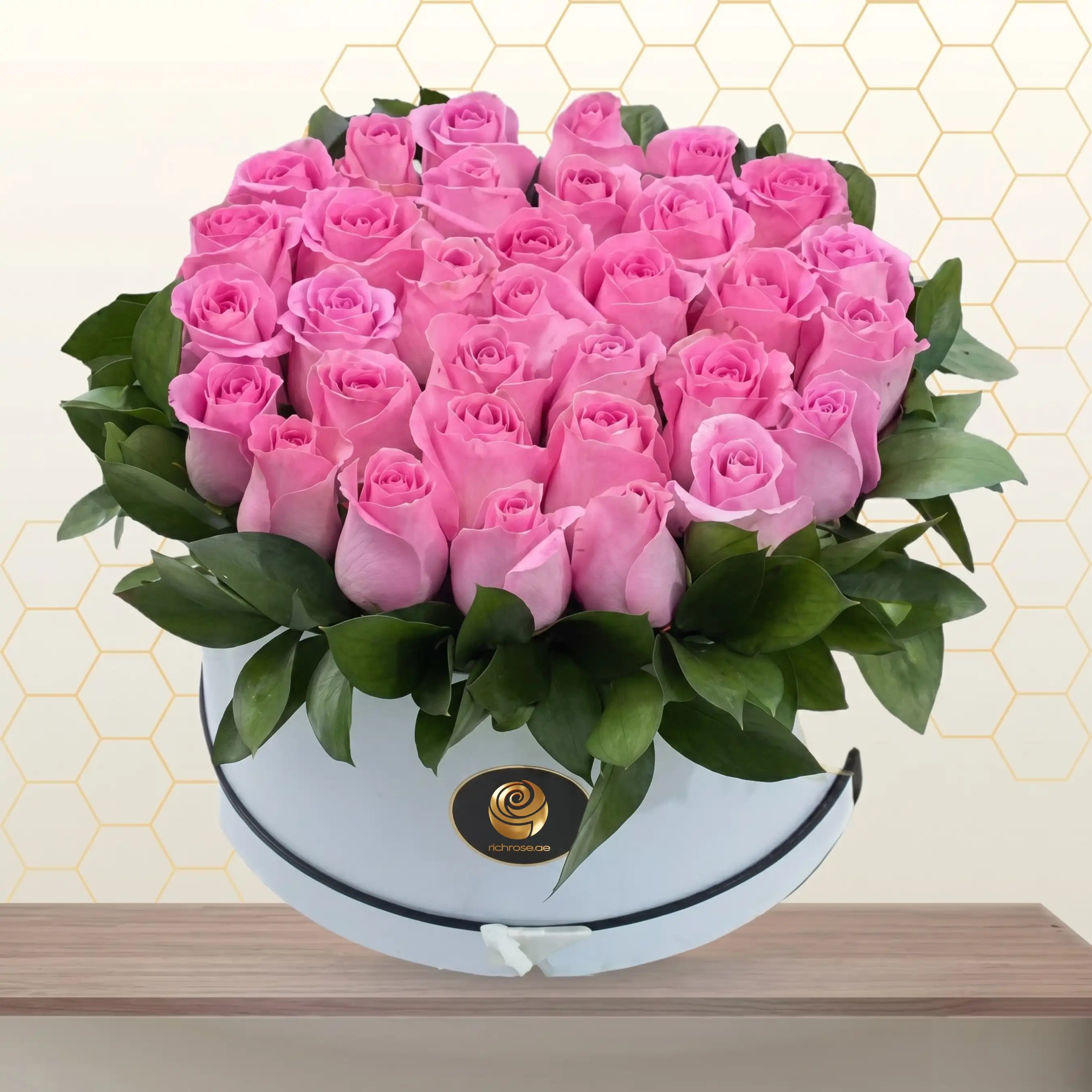 pink roses in white round box Main image