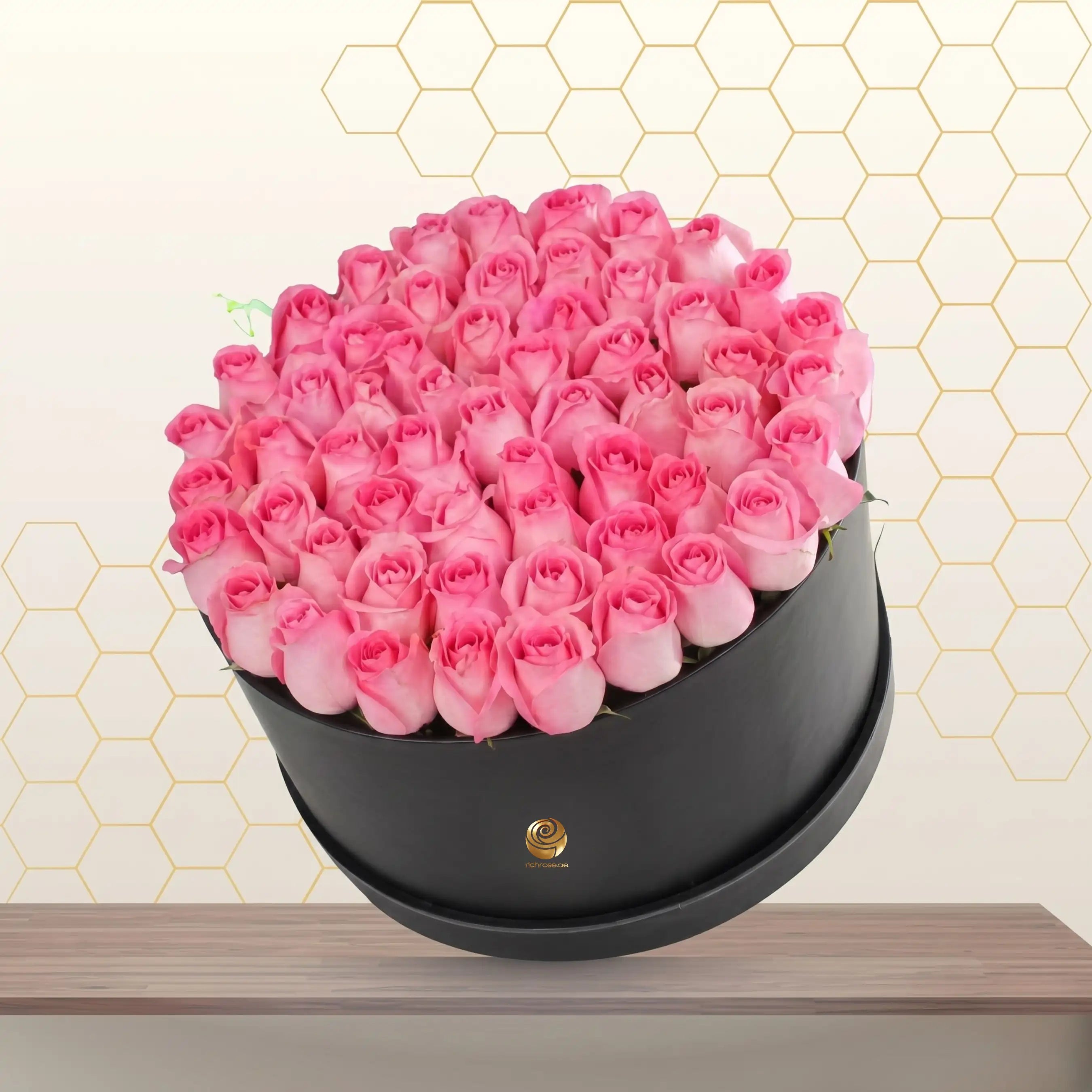 pink roses in black box Main image