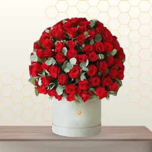 Red roses and eucalyptus arrangement in white hatbox Valentine's gift Dubai Main image