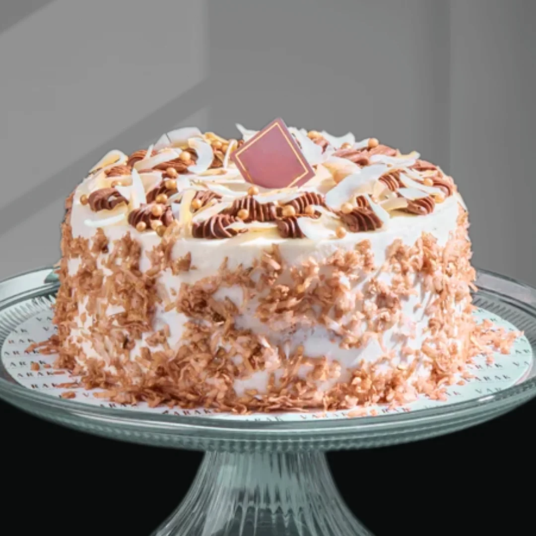 COCONUT CHOCOLATE CAKE - Chocolate cake draped in Coconut. 