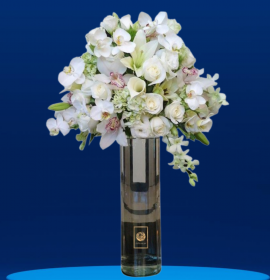 white mixed flowers in cylinder vase