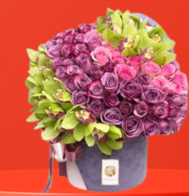 purple and green flowers in premium flowers box